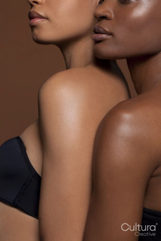 Young women standing back to front
