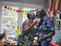 Mature couple kissing at birthday party