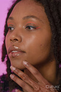 Young woman wearing pink eyeliner and piercings