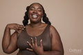 Studio shot of smiling young woman with braided hair