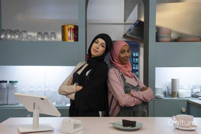 Portrait of smiling young women working in cafe