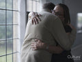 Man and woman hugging in therapy session