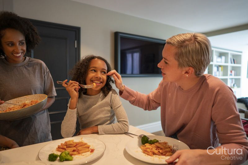 Family enjoying dinner in kitchen