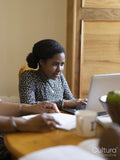 Girl doing homework on laptop