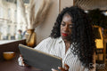 Businesswoman working on digital tablet in office