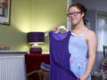 Girl with Down syndrome trying on dress