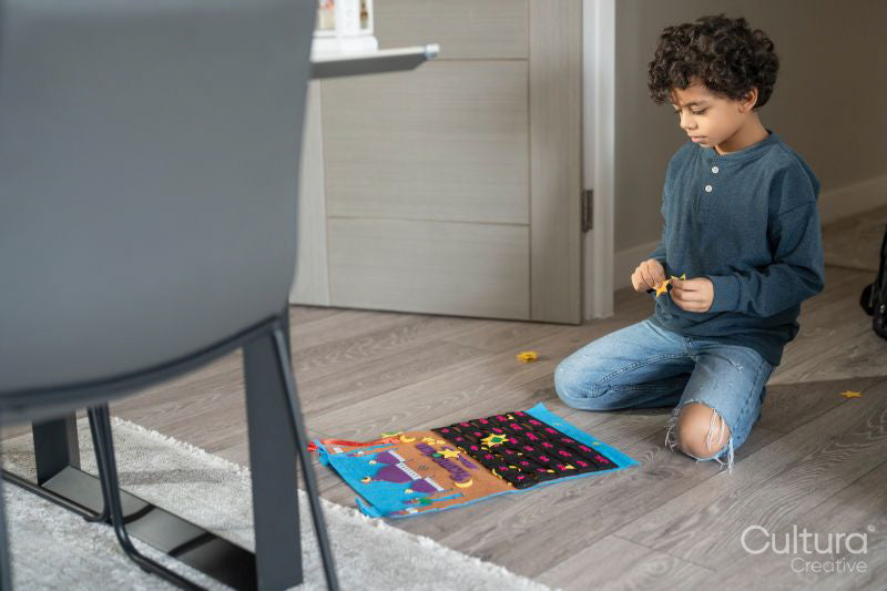 Boy playing with Velcro puzzle at home