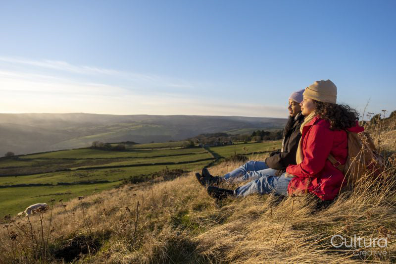 Female hikers looking at landscape