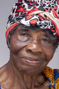 Studio portrait of senior woman wearing a headscarf