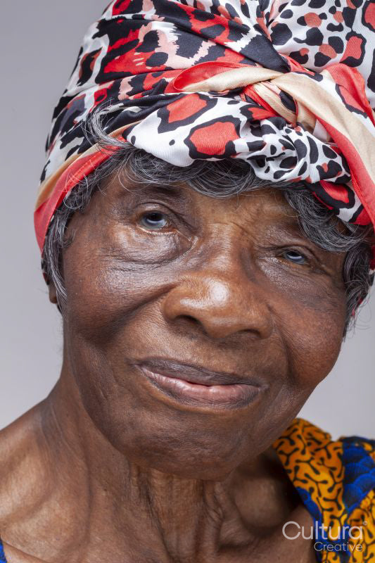 Studio portrait of senior woman wearing a headscarf