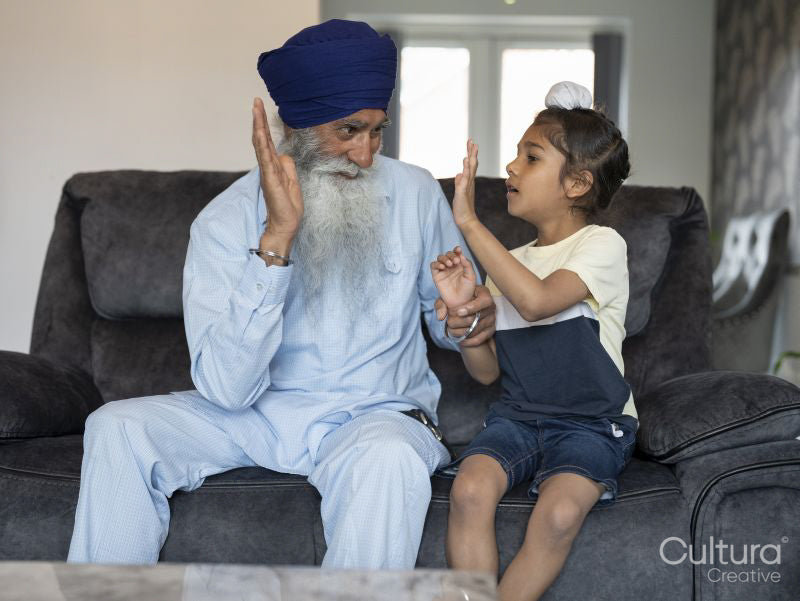 Grandfather and grandson high fiving