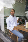 Man enjoying coffee at cafe table