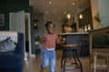 Girl running across living room