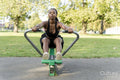 Young woman exercising in outdoor gym