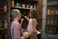 Mother and daughter removing products from pantry