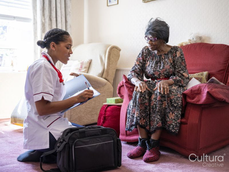 Elderly woman talking with nurse