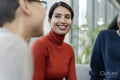 Coworkers having meeting in office lobby