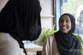 Young female friends meeting in cafe
