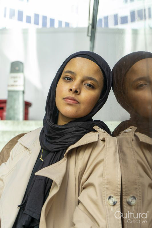 Portrait of young woman wearing hijab