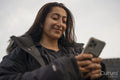 Young woman holding smartphone