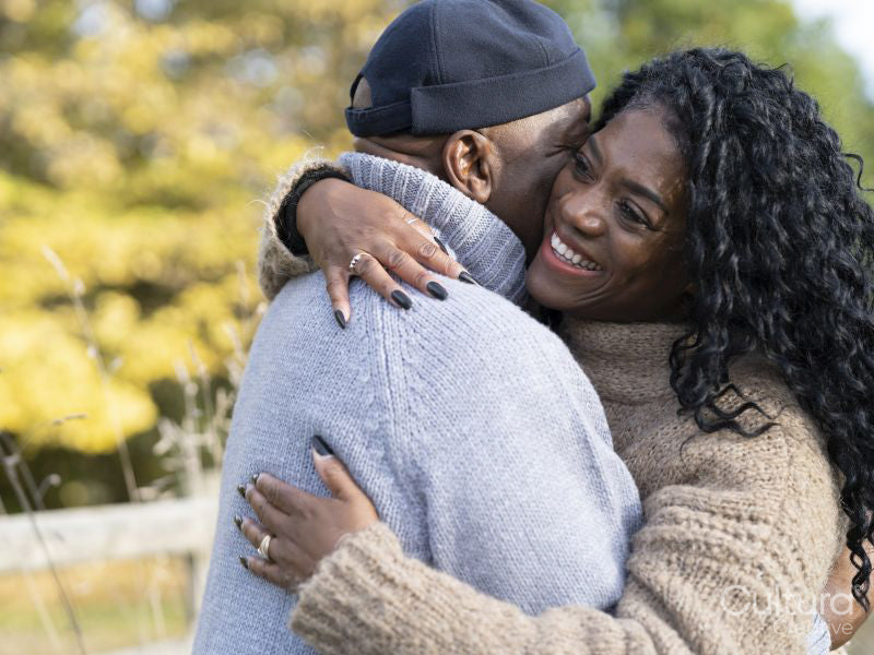 Portrait of couple embracing in nature