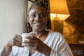 Senior woman drinking tea at home