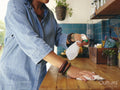 Woman cleaning kitchen counter