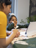 Mother homeschooling son using digital tablet