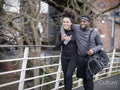 Smiling athletic couple walking outdoors