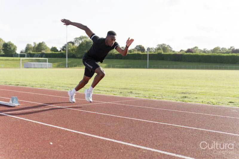 Athlete sprinting at running track