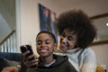 Mother and son using smart phone