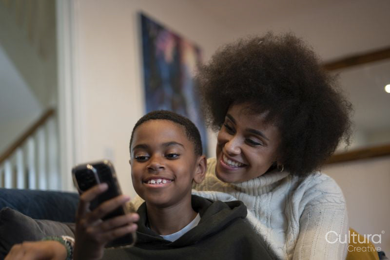 Mother and son using smart phone