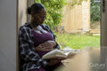Pregnant woman reading book