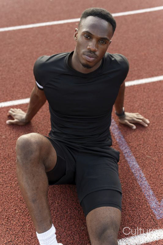 Athlete sitting at sports track after training