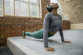 Athletic woman stretching at gym