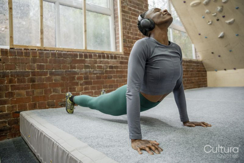 Athletic woman stretching at gym