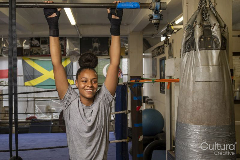 Young woman exercising at gym