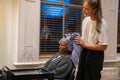 Senior woman getting hair dried in hair salon