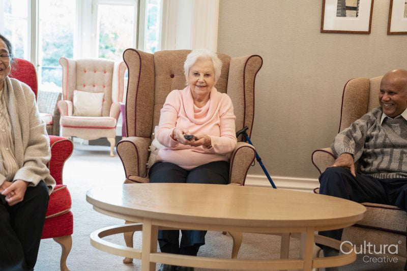 Senior people watching tv in nursing home
