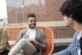 Creative professionals having meeting on office terrace