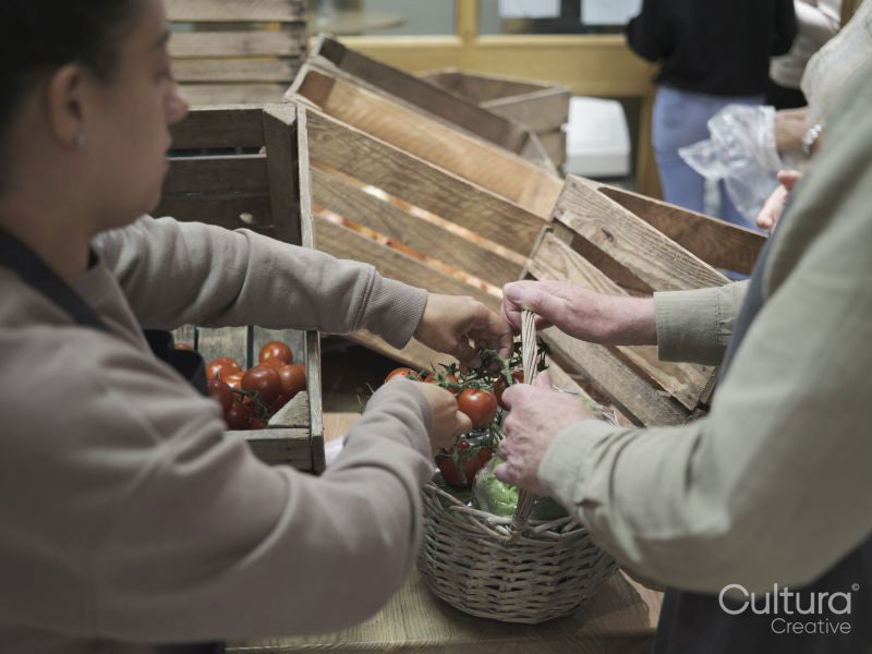 Volunteers sorting vegetables in community food center