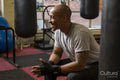 Mature man sitting in gym