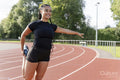 Female athlete stretching legs before training