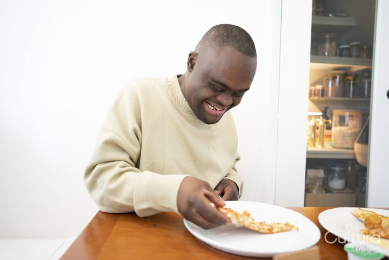 Man with Down syndrome eating pizza