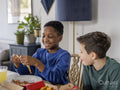 Boys eating pizza at home