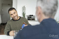 Male couple eating breakfast at home