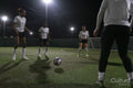 Young women playing soccer