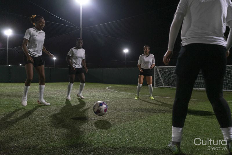 Young women playing soccer