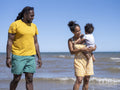 Family with son standing in sea