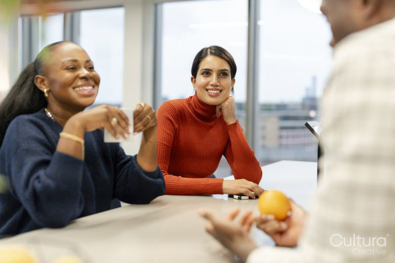 Office workers spending time together in canteen